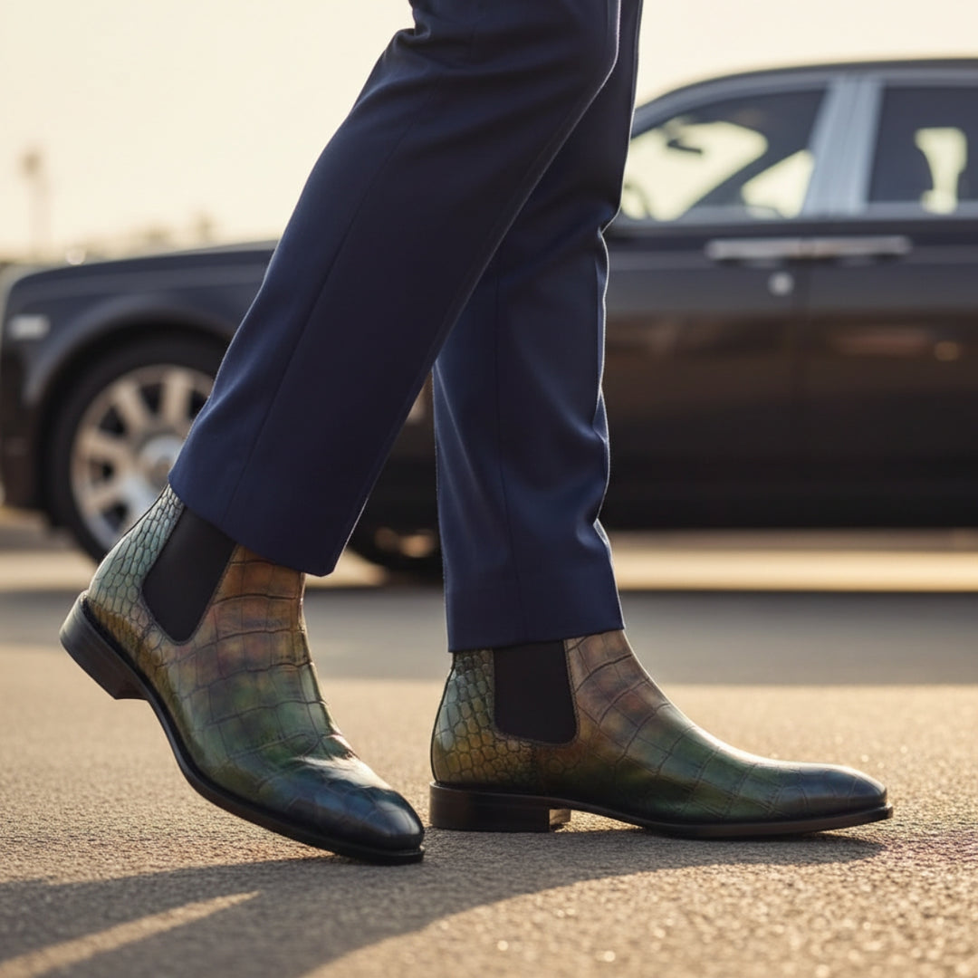 Person wearing MERRIMIUM patterned BOOTS and dark pants with a blurred car in the background