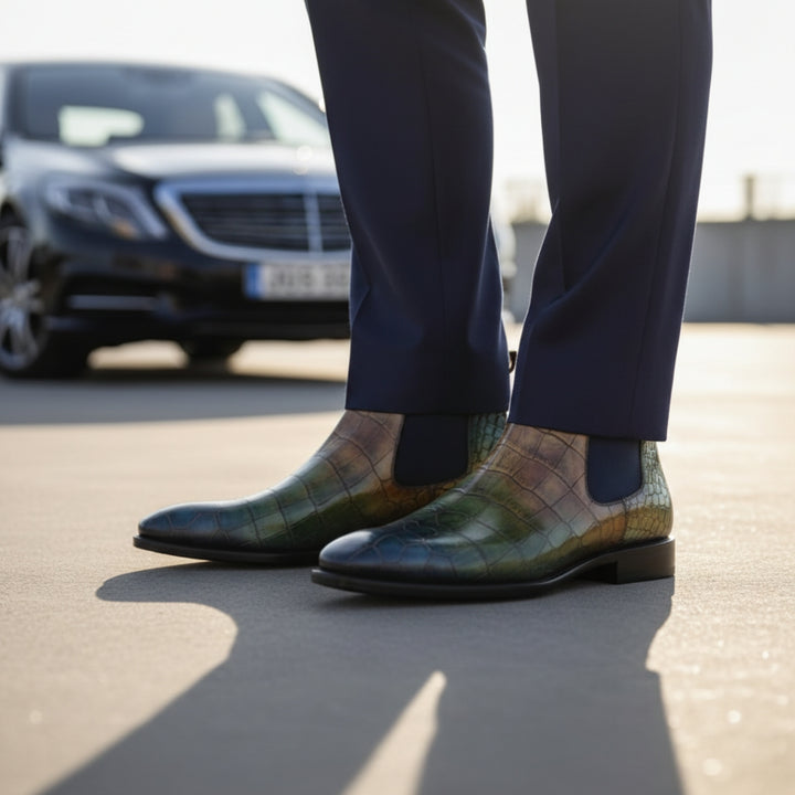 Close-up of patterned MERRIMIUM BOOTS with a blurred car in the background