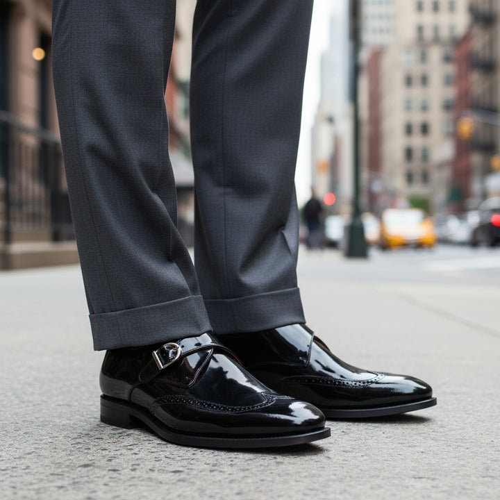 Black MERRIMIUM dress shoes and gray pants on a city street